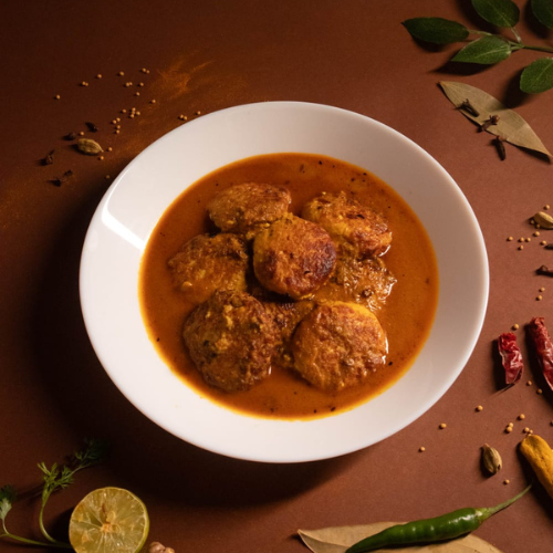 Homestyle Chhanar Dalna served in a Bengali meal